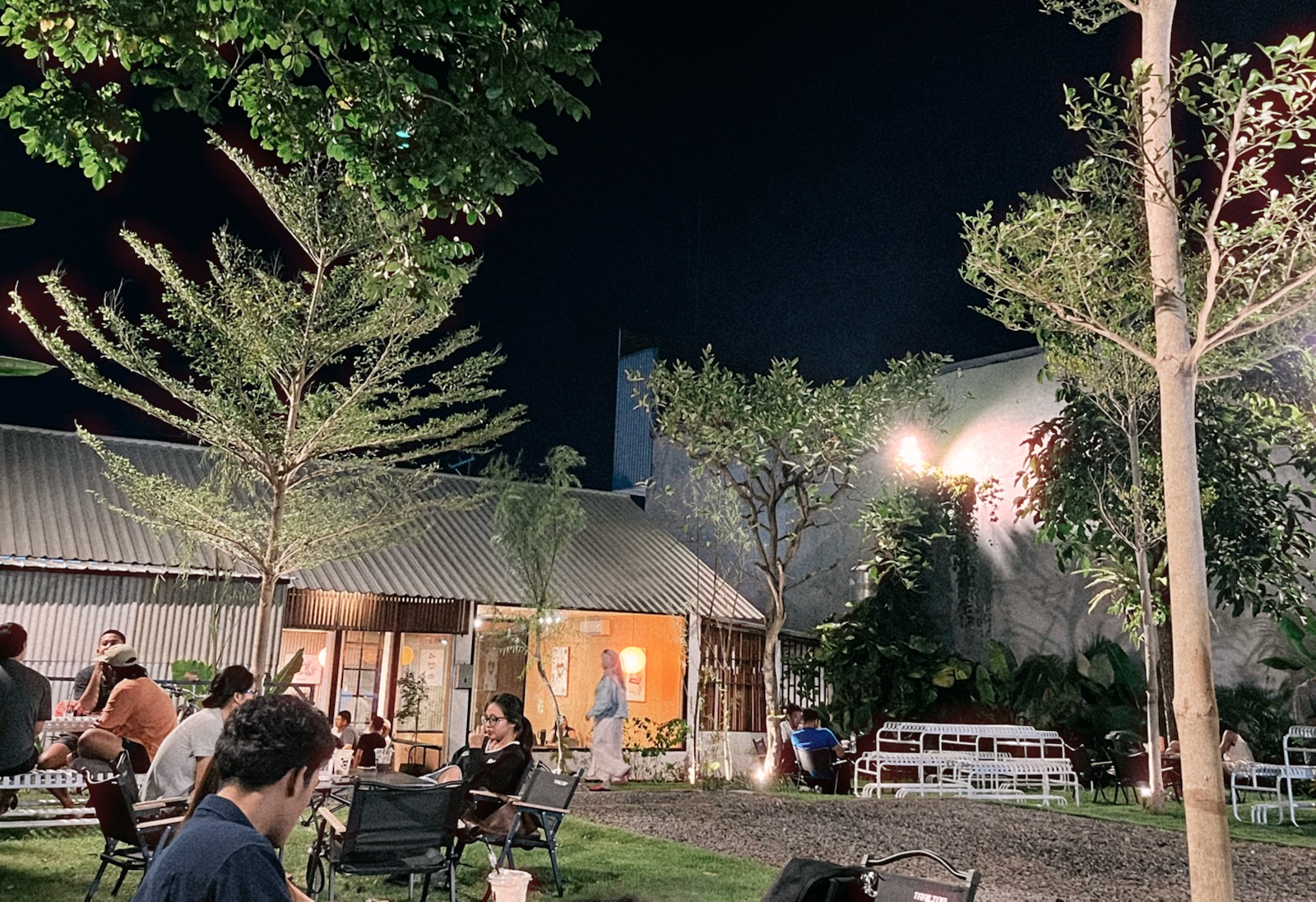 An outdoor cafe at night
